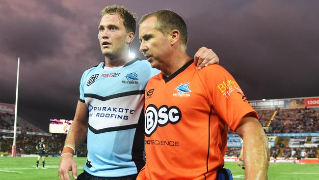 Round 3 match of the NRL Telstra Premiership between the North Queensland Cowboys v Cronulla Sharks from 1300 Smiles Stadium, Towsnville.  Sharks Matt Moylan walks off the field with the trainer. Picture: Zak Simmonds