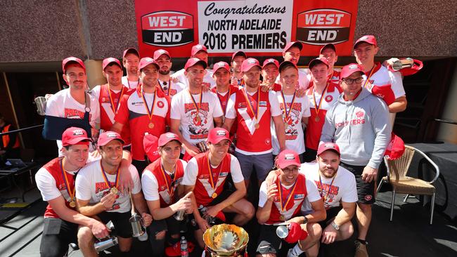 North Adelaide players celebrate with the premiership cup and medals at the chimney ceremony at West End Brewery in Thebarton on Tuesday. Picture: Tait Schmaal