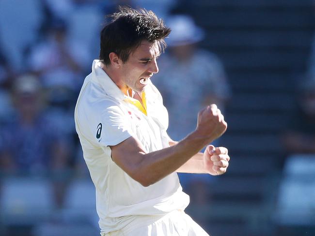 Pat Cummins celebrates taking the wicket of South Africa’s Temba Bavuma during the first day of the Third Test in Cape Town.