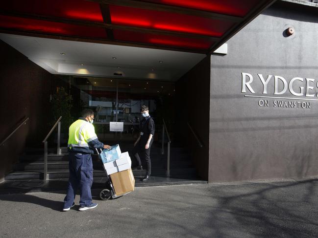 Staff at Rydges on Swanston hotel in Melbourne receive a delivery of PPE. Picture: NCA NewsWire / David Geraghty.