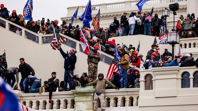 They eventually broke through the police lines and swarmed the building. Picture: Samuel Corum/Getty Images/AFP