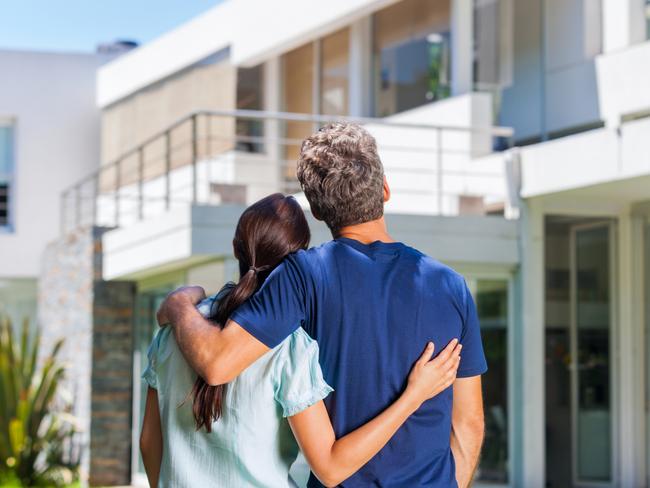 CM New estates magazine - generic young couple looking at new house