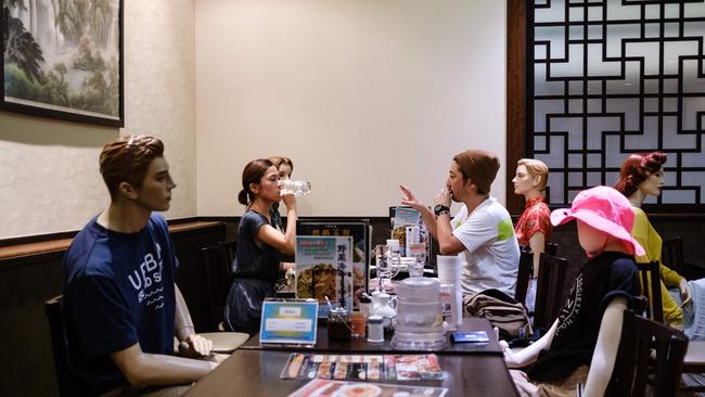 Customers dine among mannequins — used to maintain social distancing — at a restaurant in the Akabane district of Tokyo. Picture: AFP