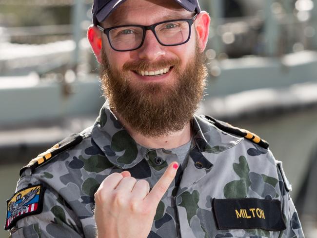 Royal Australian Navy officer, Lieutenant Maritime Warfare Officer Jonathan Milton, of minehunter coastal vessel HMAS Gascoyne, painted his pinky fingernail in support of gender equality campaign, 100 Days For Change. *** Local Caption *** Members of the Royal Australian Navy's Mine Warfare community undertook activities on 20 July 2018 in support of 100 Days For Change.  100 Days For Change runs between 1 July 2018 and 8 October 2018 and is a grassroots, action orientated initiative by Women & Leadership Australia to catalyse individuals and organisations into making achievable change to increase gender equity in their workplace.  Personnel painted their pinky fingernails pink as a visual indication of support for diversity in the workplace and positive cultural change at a bake sale hosted by, minehunter coastal crew, HMAS Huon, at Sydney base, HMAS Waterhen to support of 100 Days For Change.