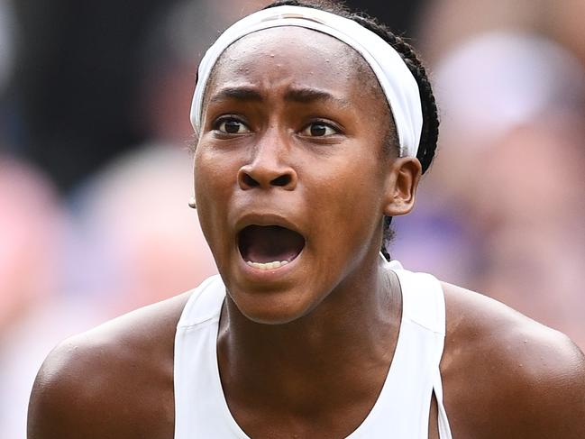 US player Cori Gauff celebrates winning the second set against Slovenia's Polona Hercog during their women's singles third round match on the fifth day of the 2019 Wimbledon Championships at The All England Lawn Tennis Club in Wimbledon, southwest London, on July 5, 2019. (Photo by Daniel LEAL-OLIVAS / AFP) / RESTRICTED TO EDITORIAL USE