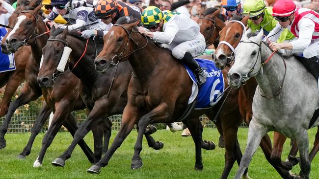 Sunshine In Paris (white silks, green and yellow checked cap) wins the Champions Sprint at Flemington in November last year. Picture: George Sal / Racing Photos