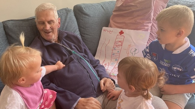 Ken Wilson with his grandkids (from left) Audrey, Violet and Henry