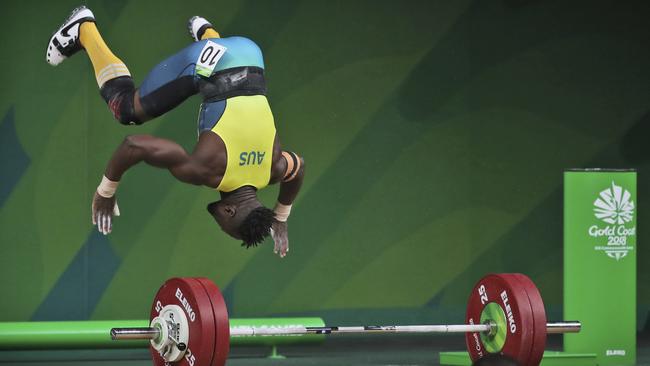 Francois Etoundi performs a celebratory backflip on his way to bronze for Australia on the Gold Coast. He fled the Cameroon team at the 2006 Melbourne Commonwealth Games. Picture: AP/Manish Swarup