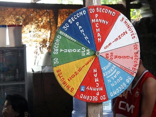 A roulette wheel allegedly used to pick a list of torture techniques meted out to prisoners in a house converted to a prison south of Manila.
