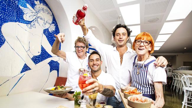 Champion Ironman Matt Poole with Oliver Frost, Karen Fines (left) and Lizzie Frost at their new Burleigh Heads restaurant Maman. Picture: Nigel Hallett