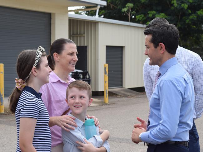 Queensland premier, David Crisafulli and member for Townsville Adam Baillie talking to victim of youth crime Jillian Joyce and her two children Felix and Charlie at Kirwan Police Station. December 13 2024.