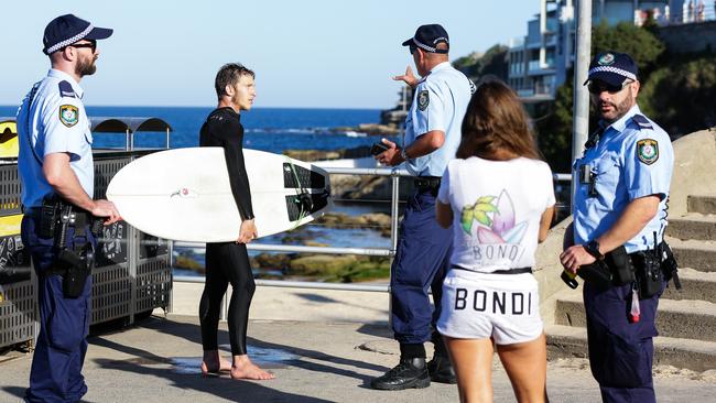 Police confront beachgoers in Sydney over the weekend. Picture: Gaye Gerard