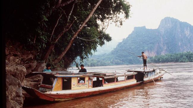 Life on the Mekong is far more sedate today than when the family fled in the 1980s.