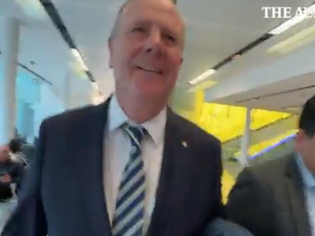 Nine chair Peter Costello has been captured on camera knocking a journalist to the ground during a scuffle at Canberra Airport. Picture: The Australian