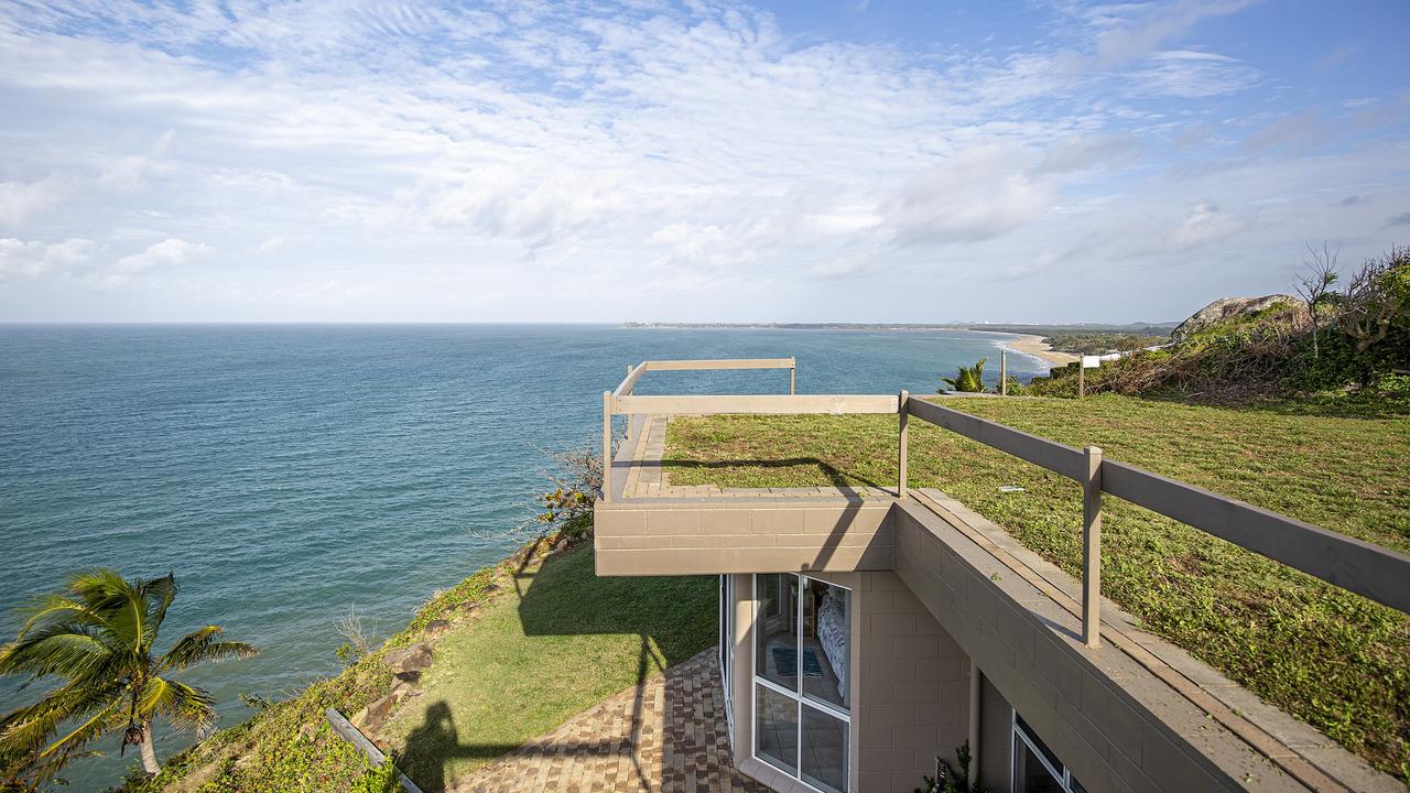 These Dolphin Heads homeowners have to mow the lawn on their roof as well as their garden.