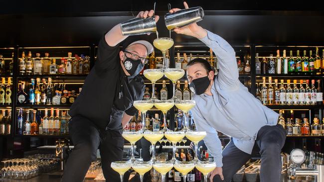 Andy Emans and Jamie Heather pouring a margarita tower at Mejico. Picture: Jay Town