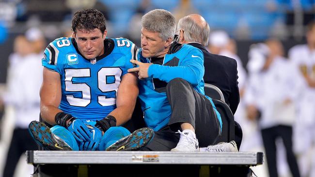 Luke Kuechly #59 of the Carolina Panthers is carted off the field.