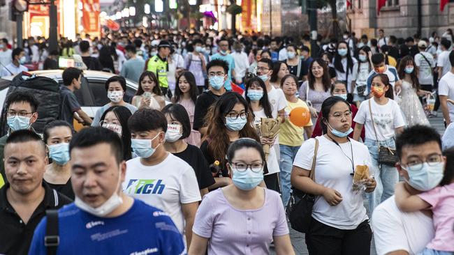 People walk in the streets of Wuhan this week. Picture: Getty Images