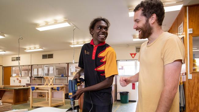 Music teacher Tim Cox helps Reece Raymond make a guitar. Picture: James Elsby