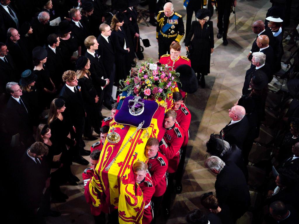 King Charles III and Camilla, Queen Consort follow behind the coffin of Queen Elizabeth II as it is carried into St George's Chapel. Picture: Getty Images