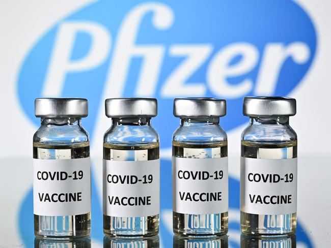 An illustration picture shows vials with Covid-19 Vaccine stickers attached, with the logo of US pharmaceutical company Pfizer, on November 17, 2020. (Photo by JUSTIN TALLIS / AFP)