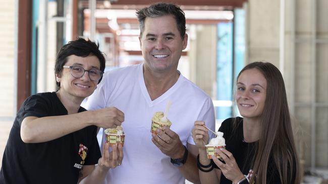 Gelato Messina employees Elisa Scovoli, left, and Alessia Ferizi, right, with Commercial &amp; General executive chairman Jamie McClurg at the Eighty Eight O’Connell development site. Picture: Brett Hartwig