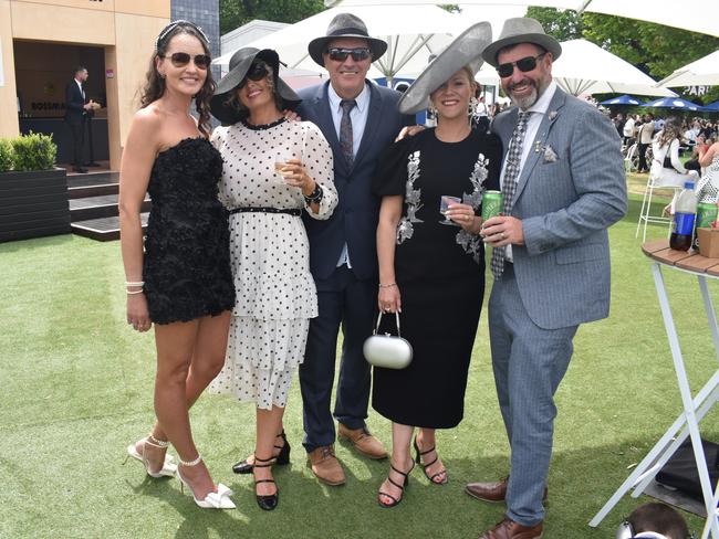 Guests in striking racewear at Penfolds Derby Day at the Flemington Racecourse on Saturday, November 02, 2024: Elizabeth Dower, Yvette Reid, Cameron Reid, Melanie Wade and Adrian Wade. Picture: Jack Colantuono