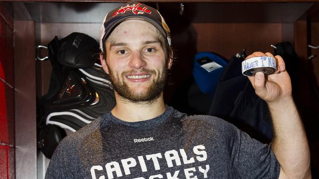 Walker with the puck commemorating his first NHL goal. Photo by Patrick McDermott/NHLI via Getty Images