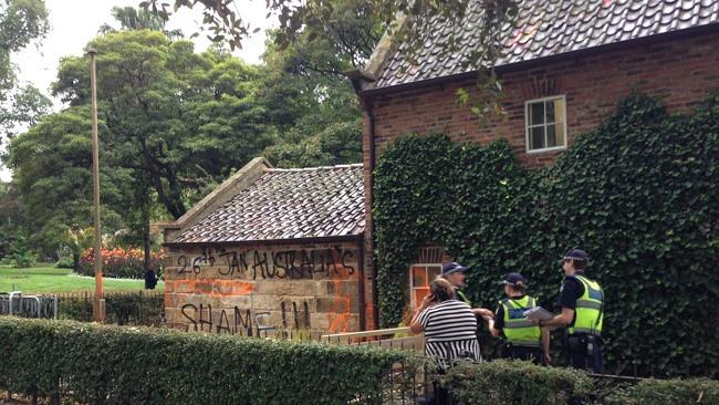 Police at Cooks' Cottage after it was vandalised overnight. 