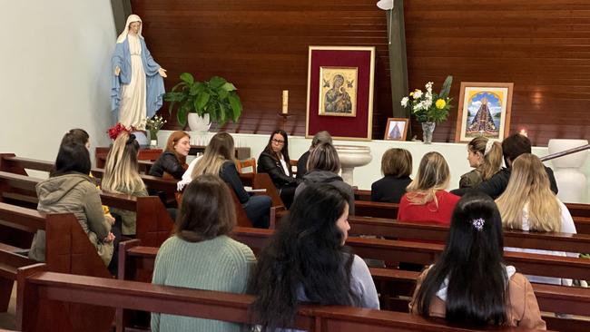 Gold Coast Brazilian group hold prayers at Calvary Catholic Church for Bazillian national Ivan Susin. (Photo/Steve Holland)