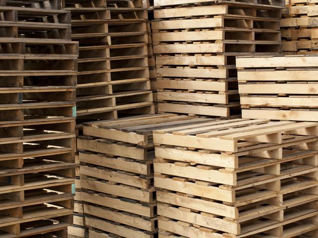 Wood shipping pallets stacked high