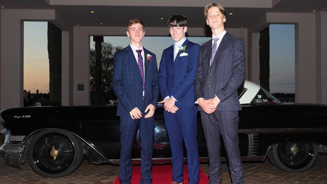 Teancum Thomas, 17, Cameron Austen, 17, and Harrison Walsh, 17, at the Ormeau Woods School formal at Links Resort, Hope Island. Picture: Glenn Hampson