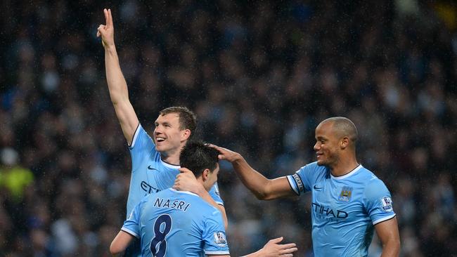 Manchester City's Bosnian striker Edin Dzeko opened the floodgates.