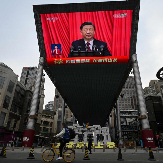 An outdoor screen in Beijing shows Chinese President Xi Jinping’s speech during the closing session of the National People's Congress at the Great Hall of the People. Picture: AFP