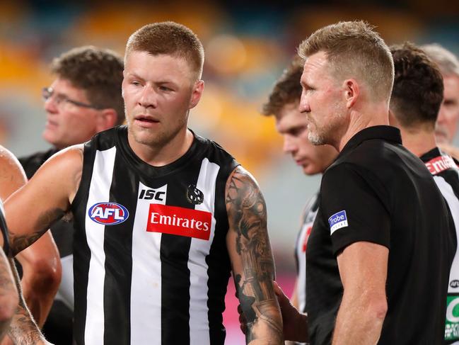 BRISBANE, AUSTRALIA - SEPTEMBER 21: Jordan De Goey of the Magpies and Nathan Buckley, Senior Coach of the Magpies are seen during the 2020 AFL Round 18 match between the Collingwood Magpies and the Port Adelaide Power at The Gabba on September 21, 2020 in Brisbane, Australia. (Photo by Michael Willson/AFL Photos via Getty Images)