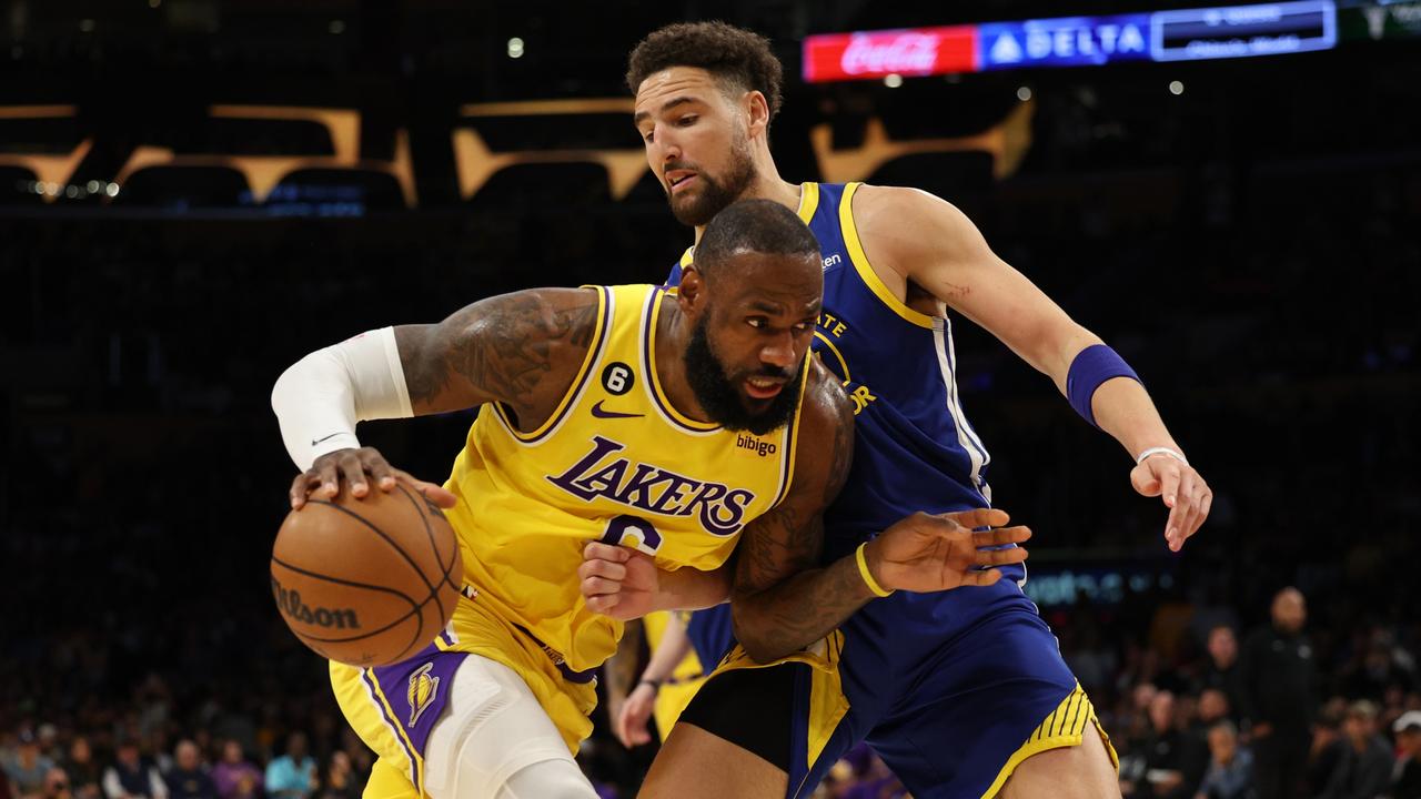 LOS ANGELES, CALIFORNIA – MAY 12: LeBron James #6 of the Los Angeles Lakers drives to the basket against Klay Thompson #11 of the Golden State Warriors during the first quarter in game six of the Western Conference Semifinal Playoffs at Crypto.com Arena on May 12, 2023 in Los Angeles, California. NOTE TO USER: User expressly acknowledges and agrees that, by downloading and or using this photograph, User is consenting to the terms and conditions of the Getty Images License Agreement. (Photo by Harry How/Getty Images)