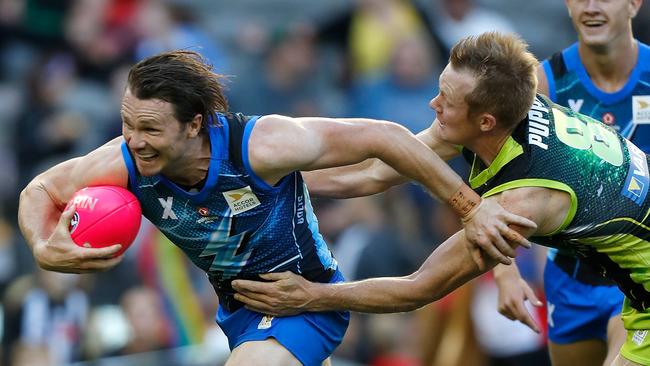 :Patrick Dangerfield playing AFLX for Team Bolts is tackled by Jack Riewoldt from Team Rampage at Marvel Stadium. Picture: Michael Willson