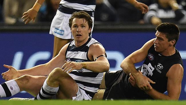 Patrick Dangerfield reacts after tackling Matthew Kreuzer.