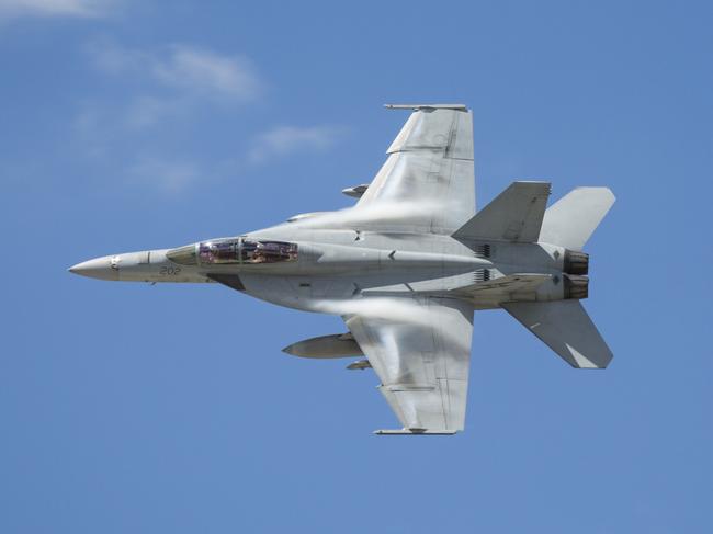 A Royal Australian Air Force F/A-18F Super Hornet arrives back in Australia at RAAF Base Amberley. *** Local Caption *** Prime Minister, the Hon Malcolm Turnbull  together with Minister for Defence, Senator the Hon Marise Payne,  Chief of the Defence Force, Air Chief Marshal Mark Binskin and Chief of Air Force, Air Marshal Leo Davies, today welcomed back to Australia the final contingent of Royal Australian Air Force strike aircraft, marking the end of Australia’s airstrike operations in Iraq and Syria.    The Australian Air Task Group was deployed on 21 September 2014 at short notice and commenced their first mission 14 days later. The Hornets have operated continuously for more than three years, flying more than 21,400 hours.