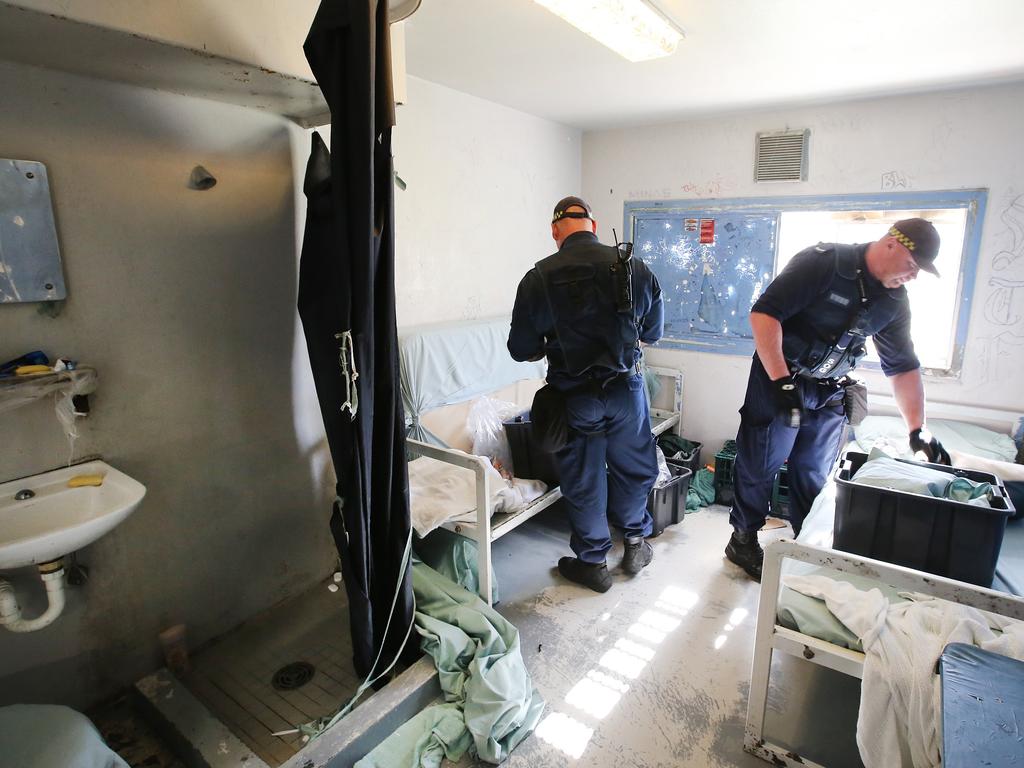 Corrective Services officers raid cells at Silverwater Jail looking for contraband. The officers now wear body cams that record the raids. Picture: Richard Dobson