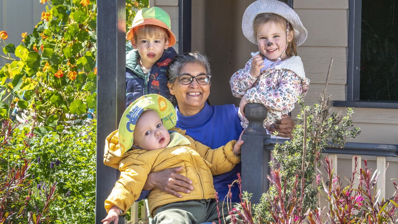 (From left) Elijah Usher, Georgette Ahfock and Darcy Stepanoff with Scott Paterson in foreground. Georgette Ahfock is recognised for her commitment to excellence in early childhood education and care. Picture: Nev Madsen.