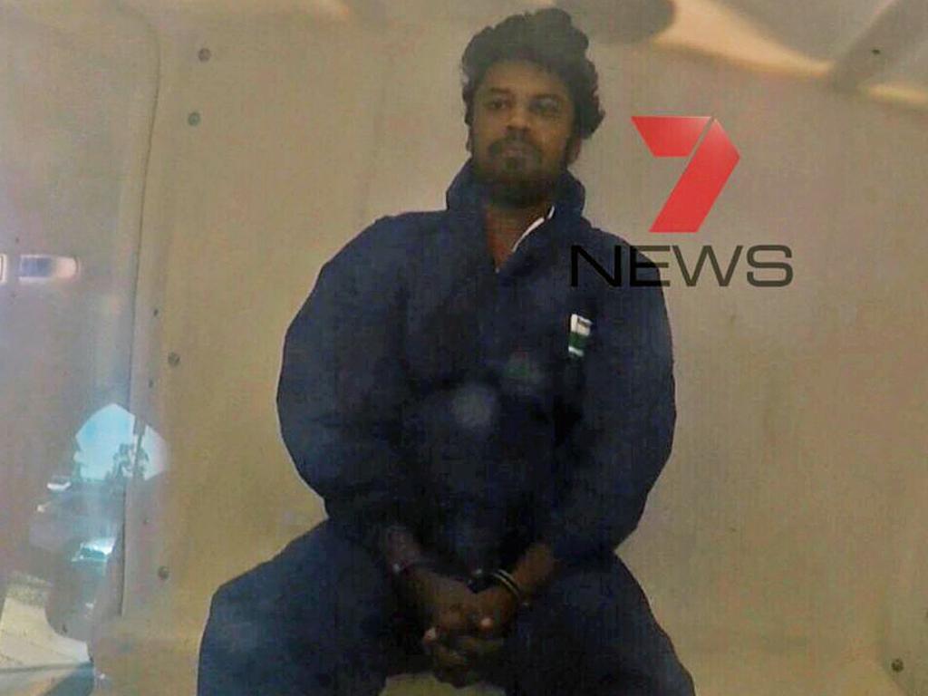 Bhanu Kirkman in the back of a NSW Police van as he's taken to court after his arrest. Picture: Seven News