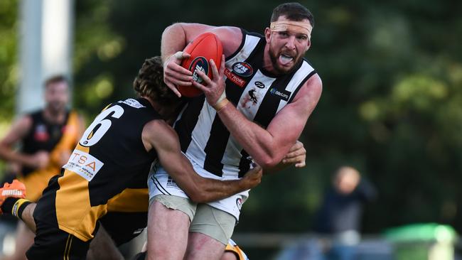 Montmorency's Jake Spencer gets tackled. Picture: Nathan McNeill