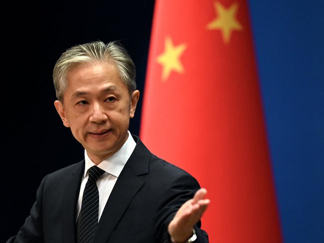 Chinese Foreign Ministry spokesman Wang Wenbin gestures during a press conference at the Ministry of Foreign Affairs in Beijing on August 8, 2022. (Photo by Noel Celis / AFP)