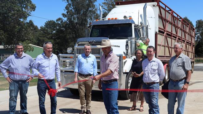 Local MP's Kevin Hogan and Chris Gulaptis, Council reps Crs Richie Williamson and Debrah Novak, Stock &amp; Station Agent Ben Clarke, Vendor Bruce Finlay and truck driver Barry McKey look on as local Stock &amp; Station Agent, Mitch Donovan does the honours and declares the new truck wash at the Grafton Saleyards open.