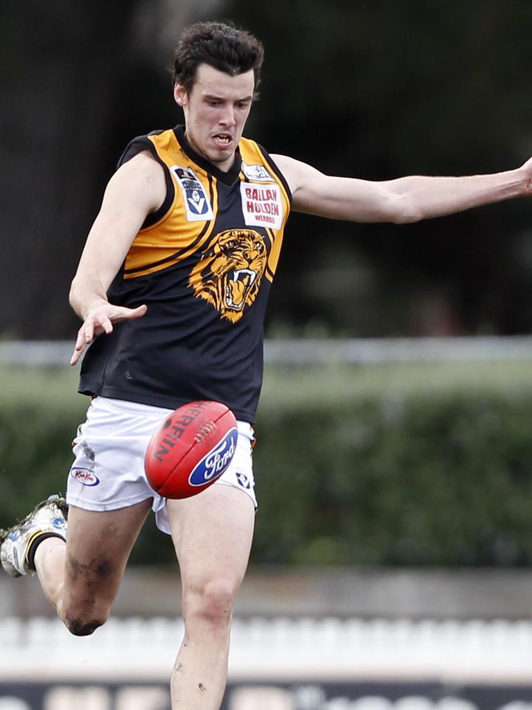 Tighe launches Werribee forward.