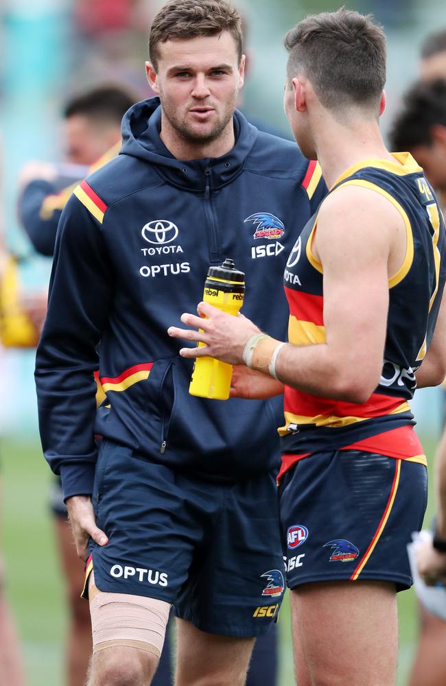 Brad Crouch holds his injured hamstring at three-quarter-time of the Crows’ clash with Essendon. Picture: Sarah Reed