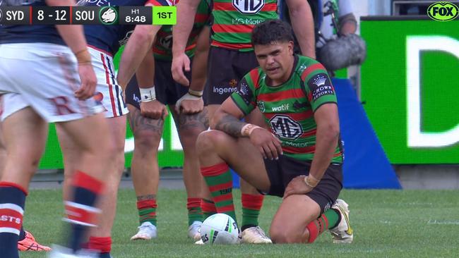 Latrell Mitchell waits for referee Ashley Klein to make a call after a tackle.