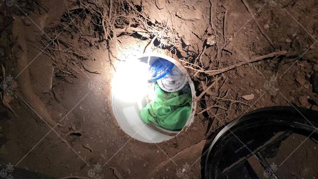 Police were watching as Cy Morris buried a plastic drum on the Darwin Esplanade before coming back and filling it with drugs and money. Picture: NT Police