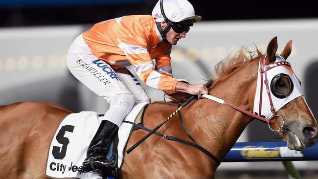 Burning Front, with Brad Rawiller aboard, wins at Moonee Valley last year. Picture: Andy Brownbill
